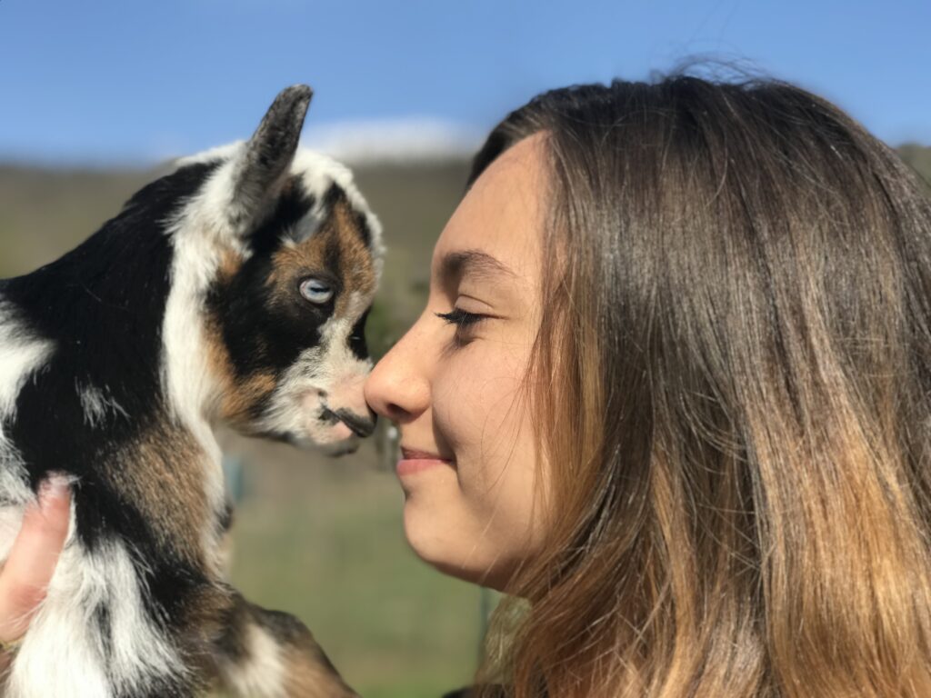 Goat Whisperer with baby goat